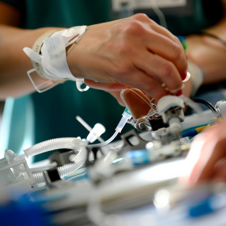 closeup healthcare professionals hands operating medical equipment emphasizing precision care clinical environment 1099133 13680