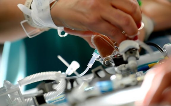 closeup healthcare professionals hands operating medical equipment emphasizing precision care clinical environment 1099133 13680